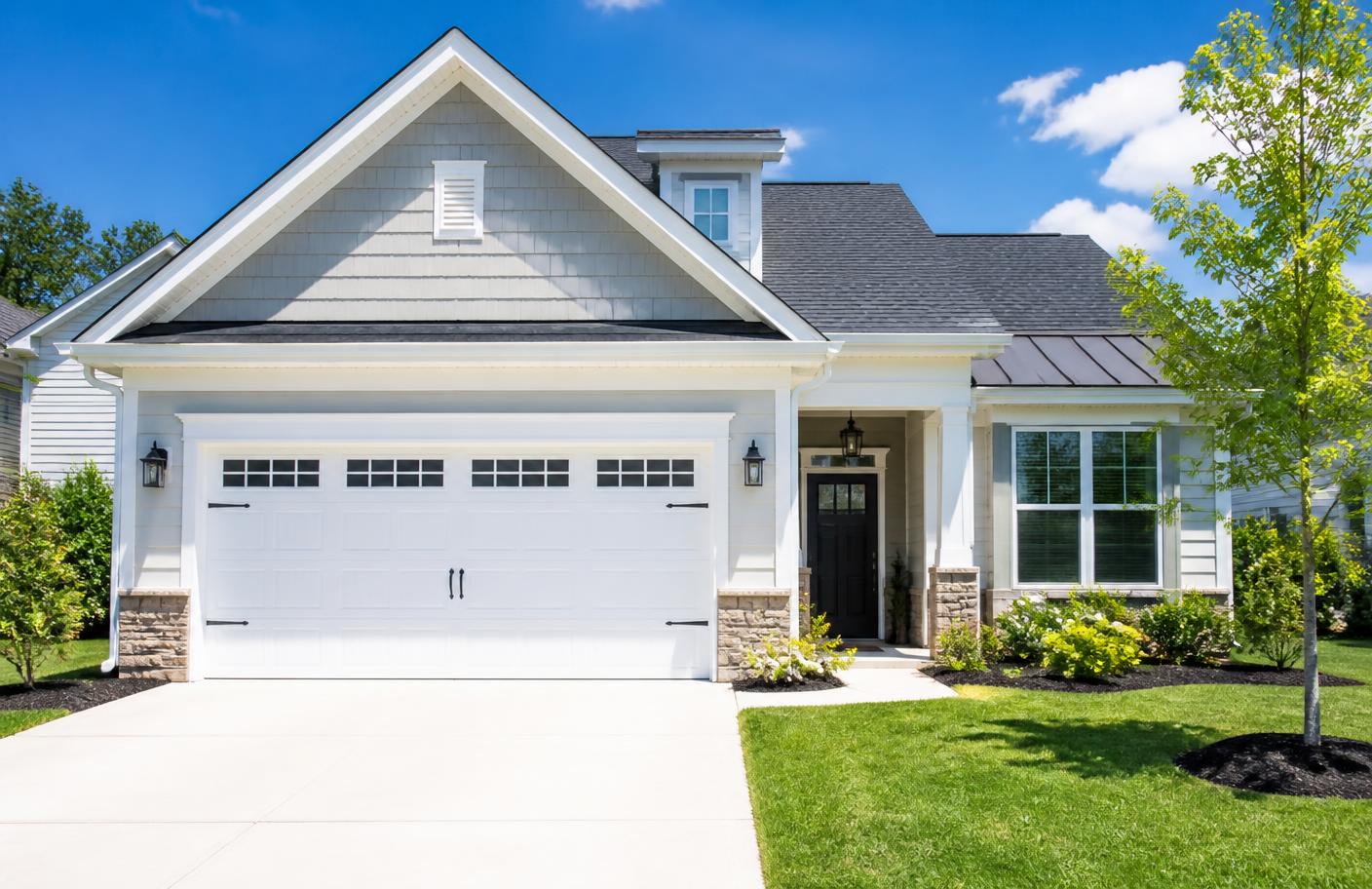 Suburban home with a clean white residential garage door